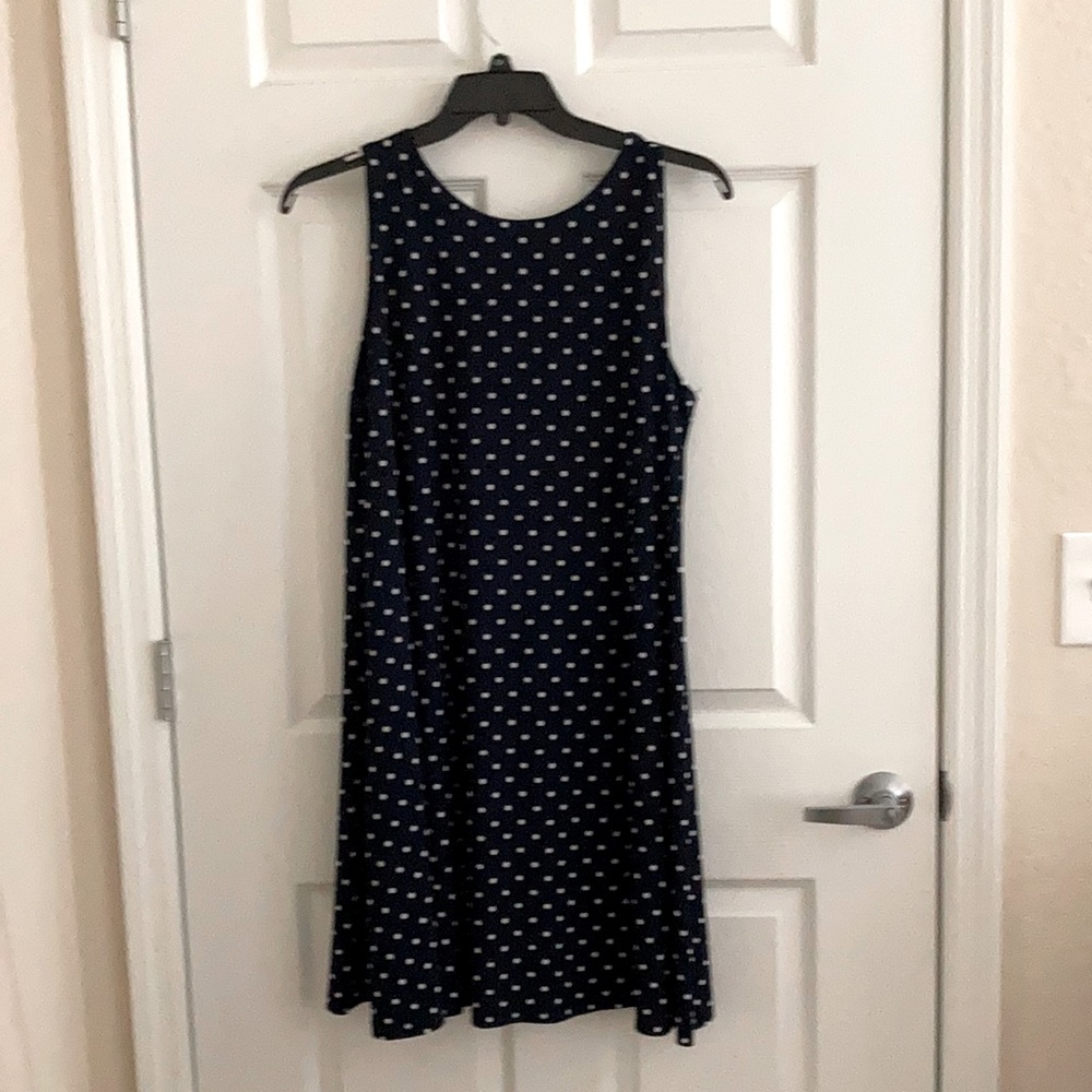 Sleeveless A line Navy dress with white dots.